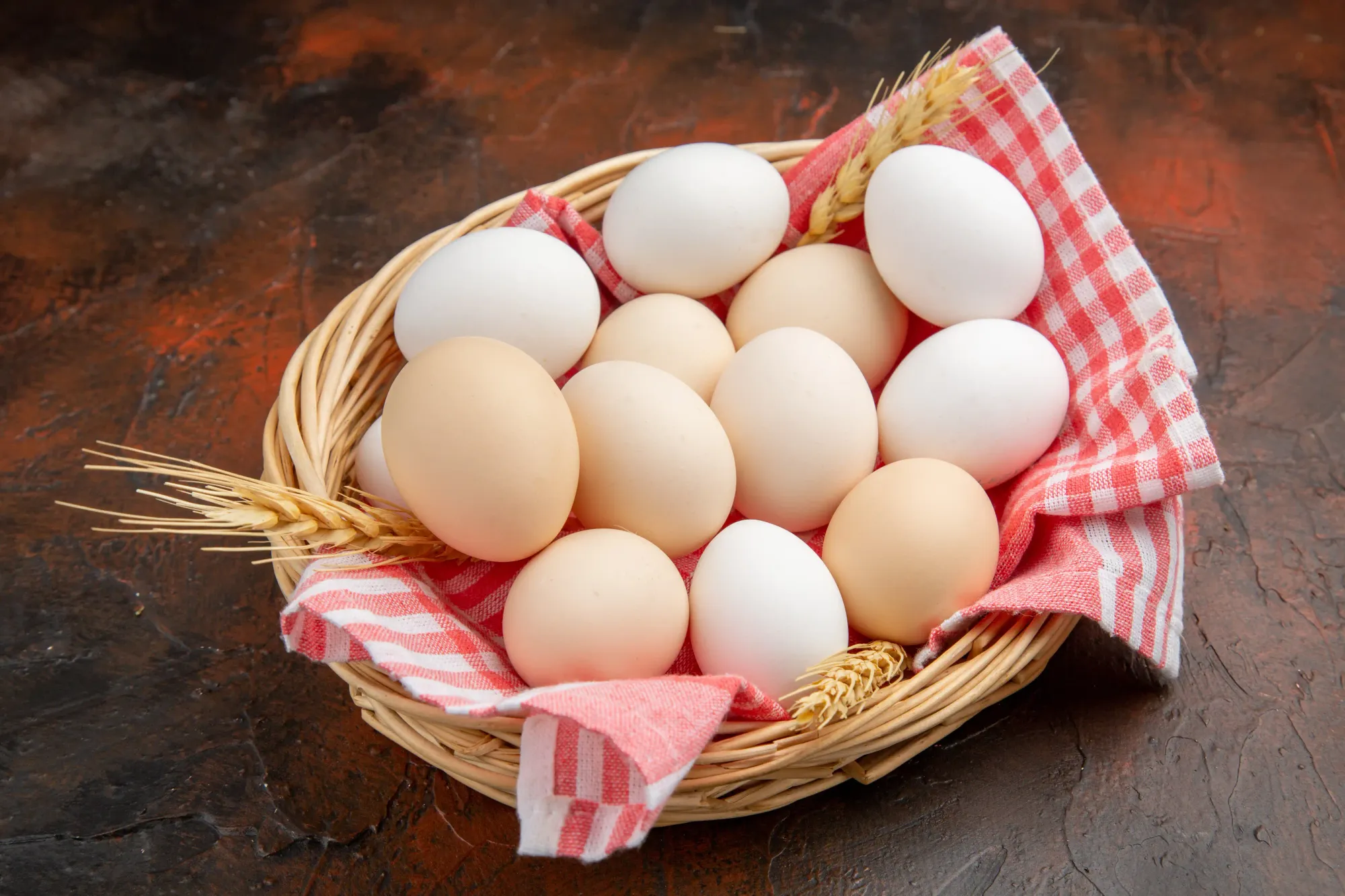 A wooden basket containing eggs.